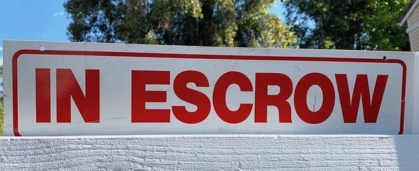 in escrow sign